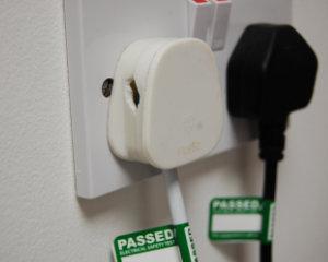 damaged plug with passed sticker