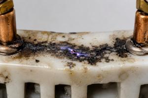 Damaged electrical connector with burn marks 