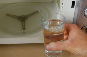 place a cup of water in the microwave