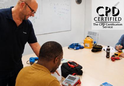 Instructor helping a delegate use a PAT tester during our CPD-accredited PAT Competent Person course