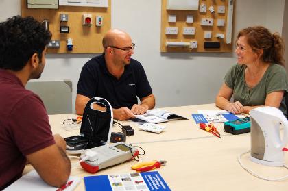 Instructor discussing appliance testing with delegates on our one-day PAT Competent Person course